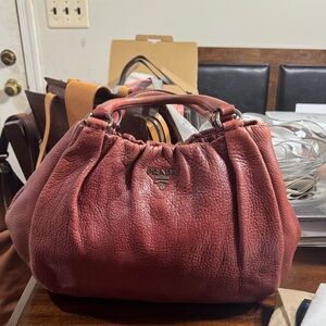 Prada Deep Red Pebbled Leather Drawstring Top-Handle Bag